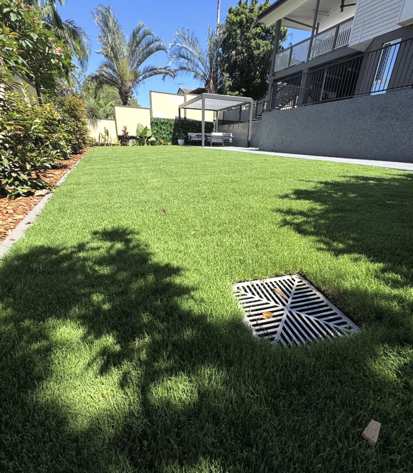 Freshly laid turf installation with clean finished lawn edges